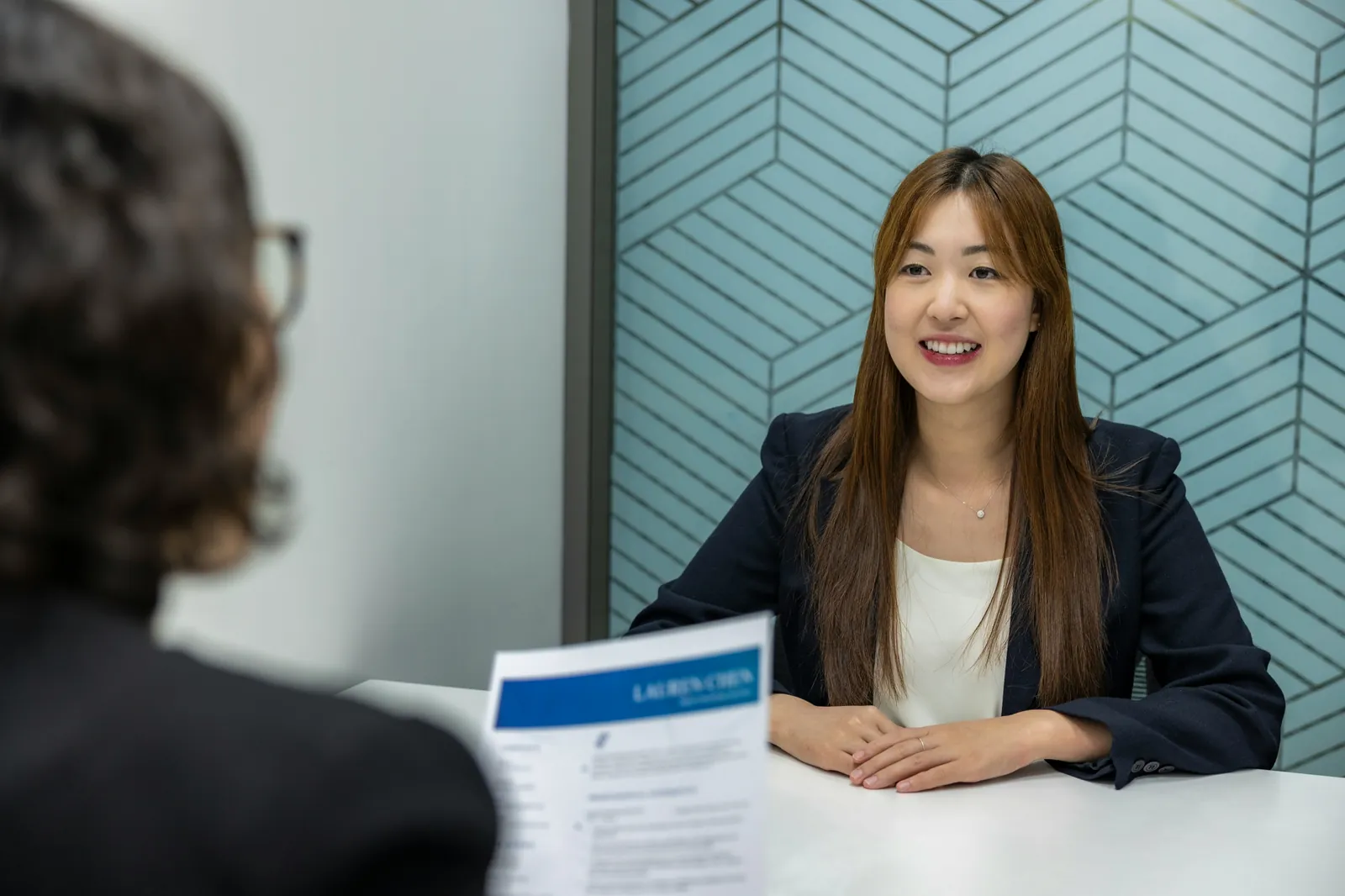 A researcher interviewing a participant