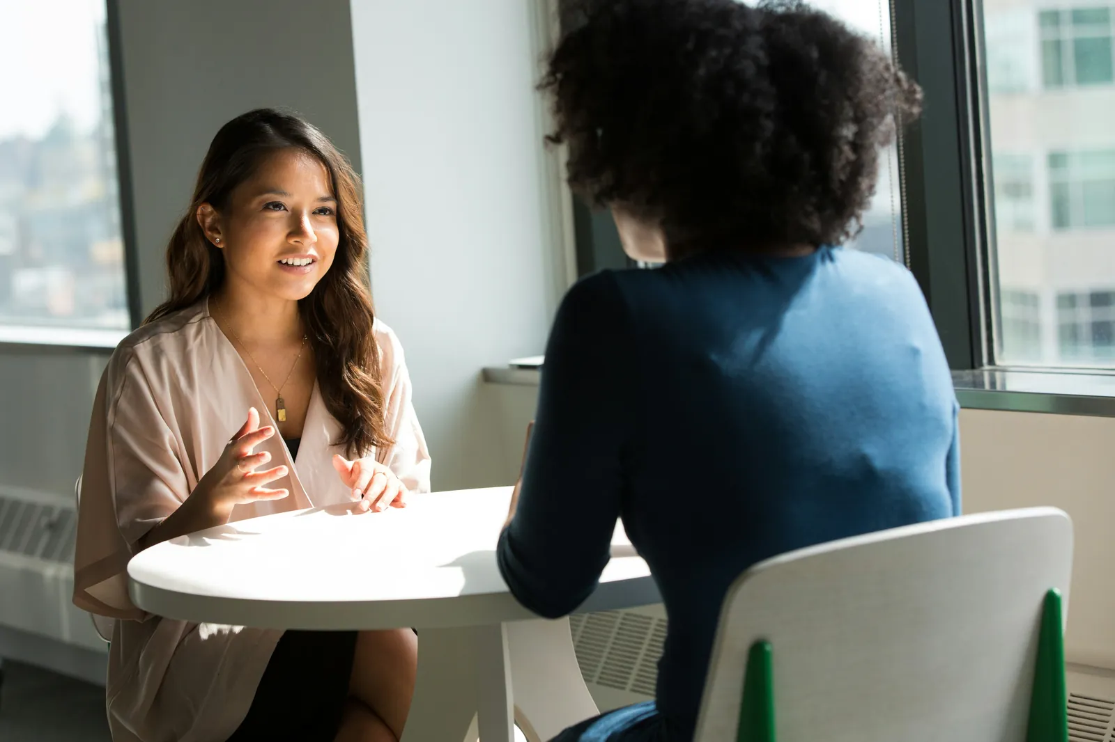 Two people in a research conversation